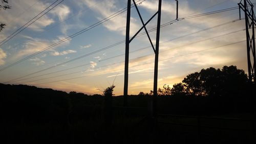 Silhouette landscape against sky during sunset