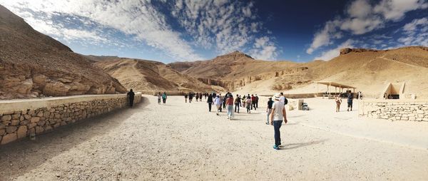 Panoramic view of people walking on mountain