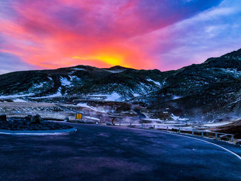 Scenic view of snowcapped mountains against sky during sunset