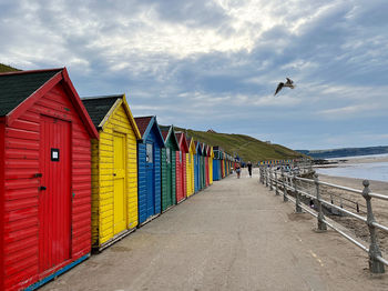 Low angle view of beach against cloudy sky