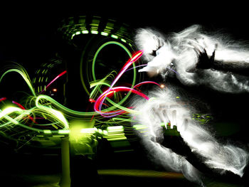 Light painting against sky at night
