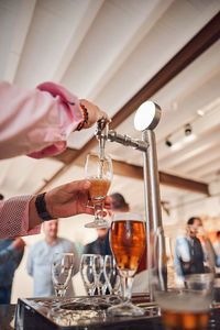 Close-up of wine glasses on glass table