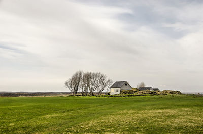 Tiny traditional house on a seemingly endless plain