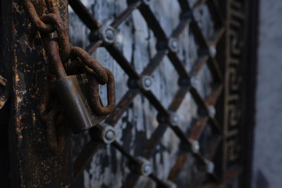 Close-up of padlock on metal gate