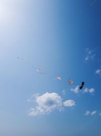 Low angle view of airshow against sky