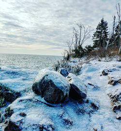 Scenic view of sea against sky during winter