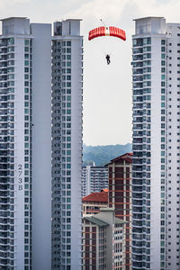 Low angle view of buildings in city against sky