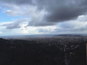 Aerial view of cityscape against sky