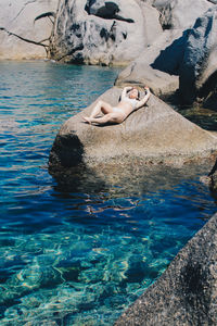 High angle view of young woman swimming in pool