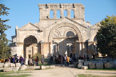 Group of people in front of historical building