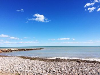 Scenic view of sea against cloudy sky