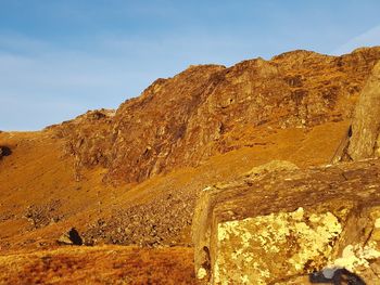 Ben dorain, bridge of orchy, golden sunset  on rocks