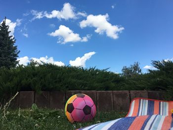Soccer field against blue sky