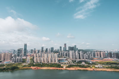 Modern buildings against sky in city