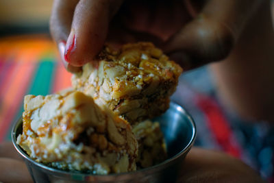 Close-up of hand holding ice cream