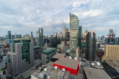 High angle view of buildings in city against sky