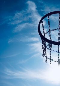 Basketball hoop and blue sky on the street