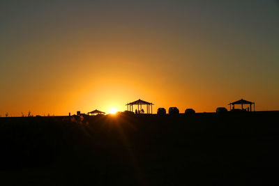 Silhouette of vehicle at sunset