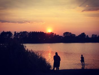 Scenic view of sunset over lake