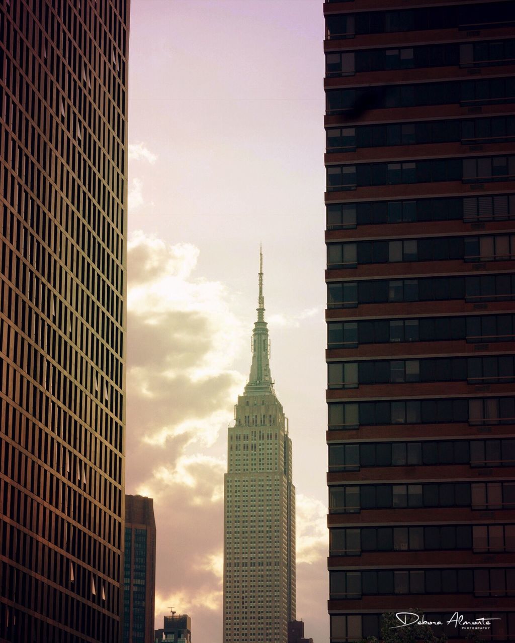 building exterior, built structure, architecture, building, office building exterior, tower, skyscraper, city, tall - high, sky, travel destinations, no people, office, modern, spire, cloud - sky, tourism, travel, nature, outdoors, financial district