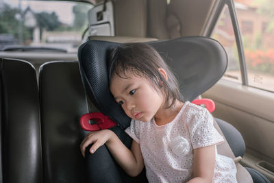 Girl sitting in car