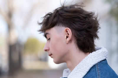 Young man with mullet hairstyle