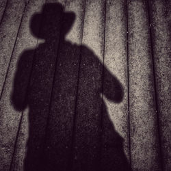 High angle view of shadow on wall