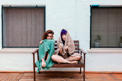 Two young women in the backyard in the summer having fun