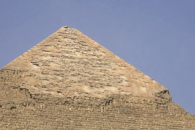 Low angle view of old ruins against clear sky