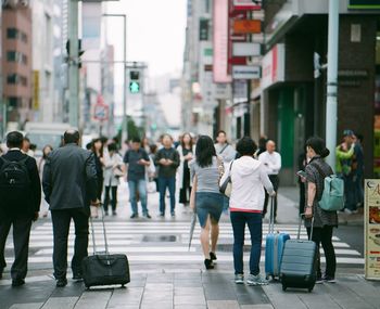 People walking on street in city