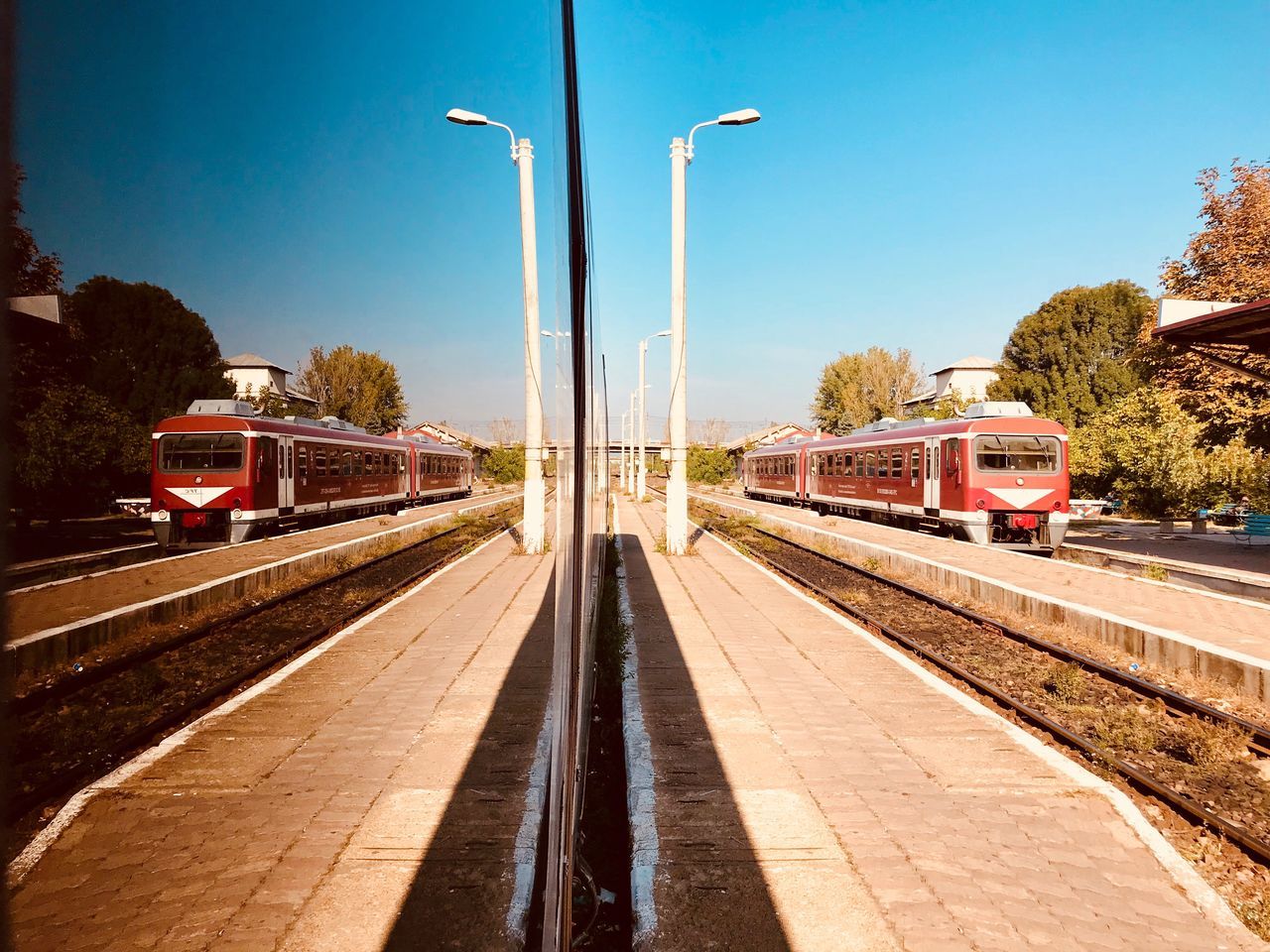 transportation, mode of transport, rail transportation, train - vehicle, railroad track, public transportation, day, no people, land vehicle, outdoors, sky, tree