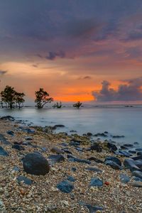 Scenic view of sea against sky during sunset