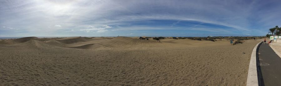 Panoramic view of desert against sky