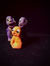 Close-up of stuffed toy over black background