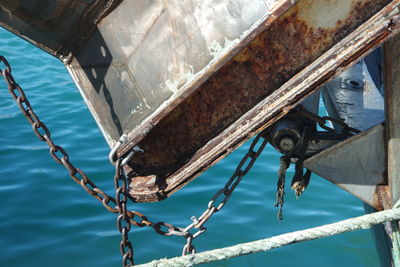 Close-up of rusty ship in sea