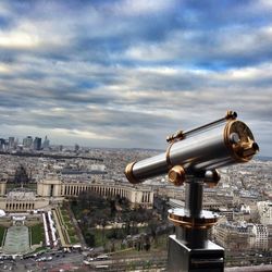 Cityscape against cloudy sky