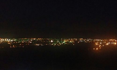 Illuminated cityscape at night