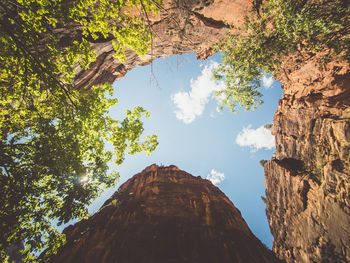 Low angle view of rock formation against sky