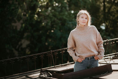 Portrait of woman standing outdoors