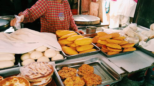 Midsection of person preparing food