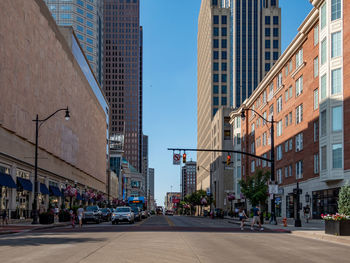 City street amidst buildings against sky