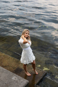 Full length of young woman in water