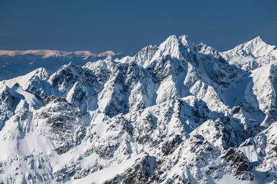 Aerial view of snowcapped mountains against sky. view from lomnica, tatra mountains, poland