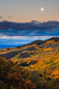 Scenic view of mountains against sky at sunset