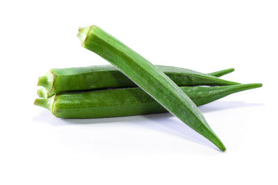 Close-up of green pepper against white background