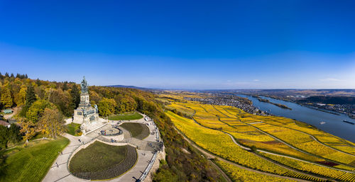 High angle view of landscape against blue sky