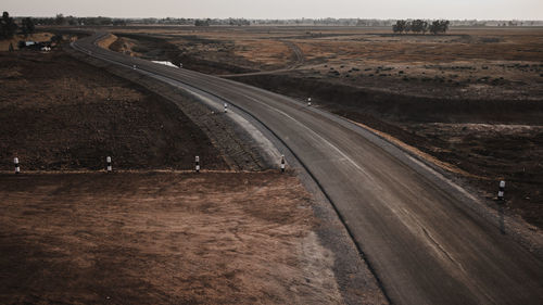 High angle view of road passing through land