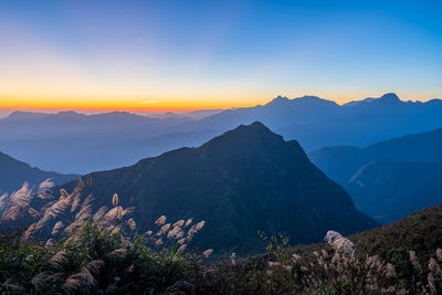 Scenic view of mountains against sky during sunset