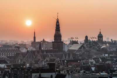 Cityscape against sky during sunset