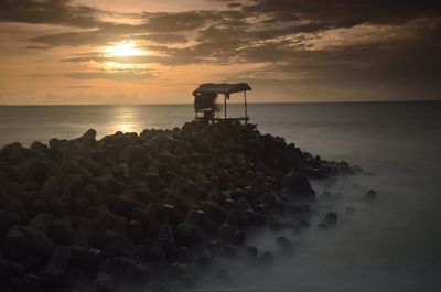 Scenic view of sea against sky during sunset